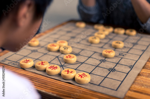people playing chinese chess in park