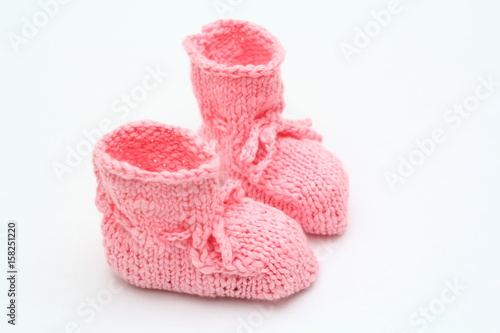 Pink knitted baby boots