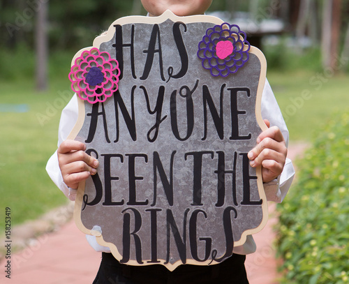 Has Anyone Seen the Rings Sign held by ring bearer photo
