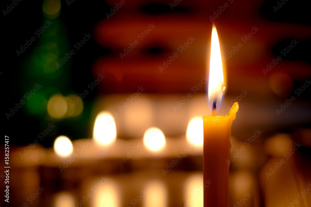 Candles light with book in the Church in the Church Candles light with book in the Church in the Church