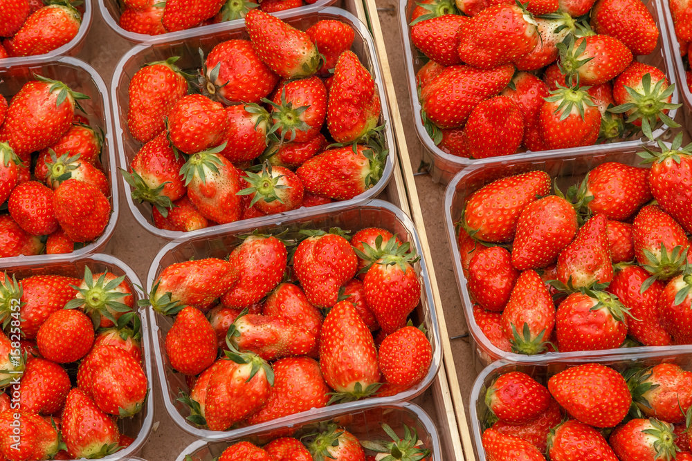 Fresh red ripe strawberries in plastic boxes. Fresh red ripe strawberries in plastic boxes.