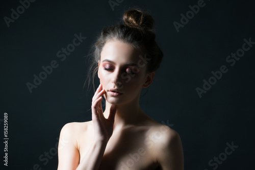 Beauty woman closeup isolated on black background. Beautiful makeup.
