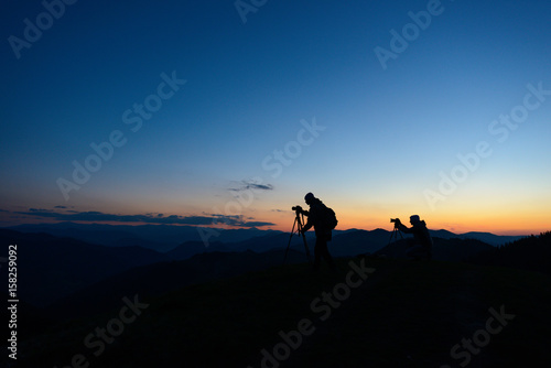 Nature photographer taking photos in the mountains © dvv1989