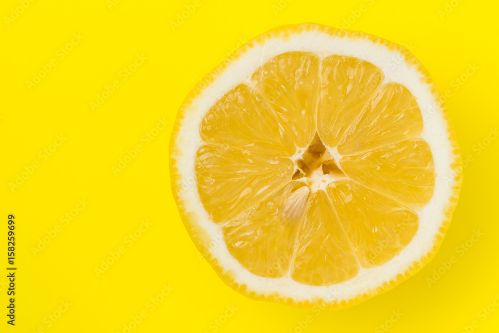 Top view of lemon on yellow back ground Top view of lemon on yellow back ground
