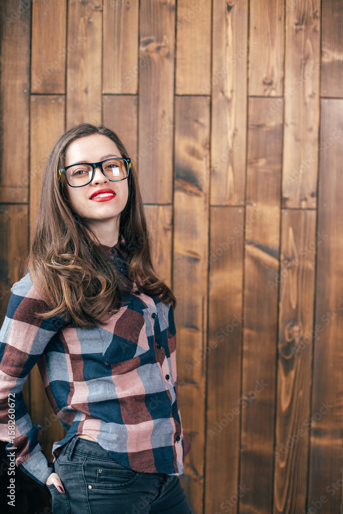 Fototapeta premium Cool hipster student woman wearing eyewear glasses . Caucasian female university student looking at camera smiling happy.
