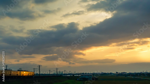 Train going towards the morning sun.