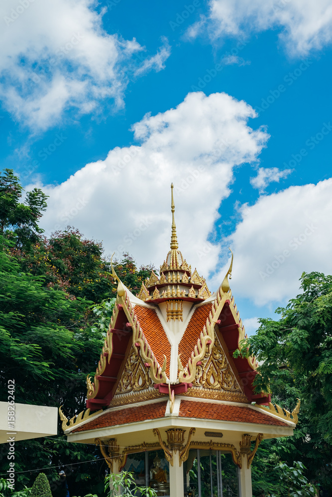 Thai pagoda with green tree and clear blue sky Thai pagoda with green tree and clear blue sky
