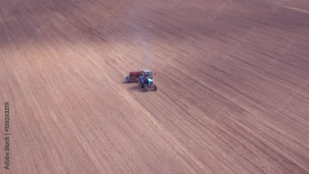Aerial view of tractor on Prepare a field for planting Aerial view of tractor on Prepare a field for planting