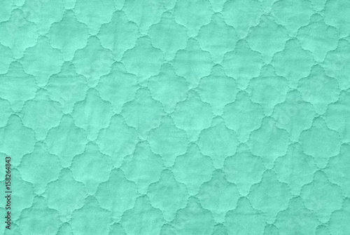 green textures background, close-up of sea green quilt, aquamarine counterpane bedspread