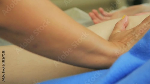 Wallpaper Mural girl masseur doing general, therapeutic body massage. massage of the hands and feet. Face masseuses not in frame. Camera moves. Torontodigital.ca