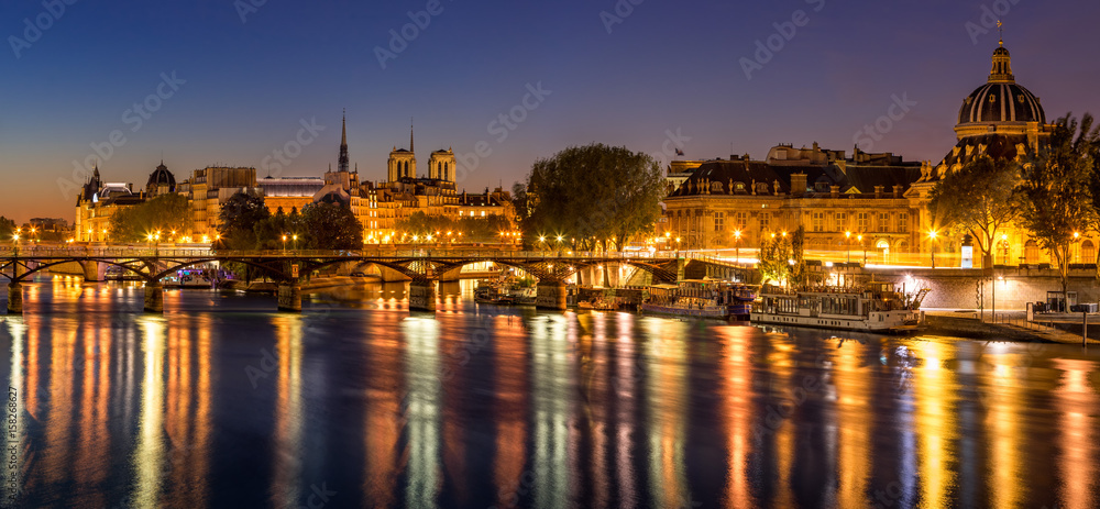 Dawn on Ile de la Cite and the Seine River with view on the French Institute and Pont des Arts. 4th and 6th Arrondissements. Paris, France