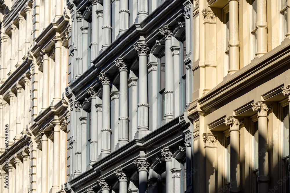 Fototapeta premium Cast iron facades and ornamentation. Nineteenth century buildings in Manhattan's Soho neighborhood. New York City