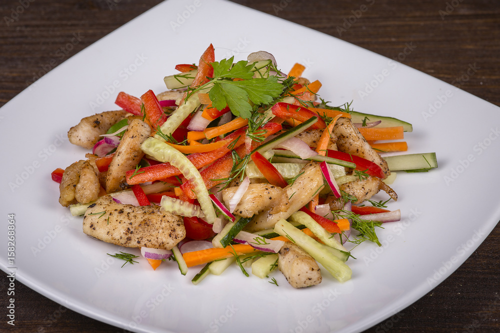 Fresh vegetable salad with chicken meat in white plate Fresh vegetable salad with chicken meat in white plate
