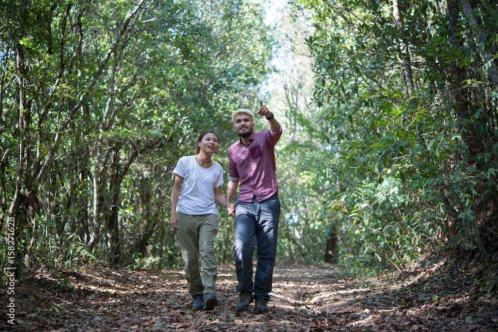 Couple go adventure hiking in mountain asia forest. Couple go adventure hiking in mountain asia forest.
