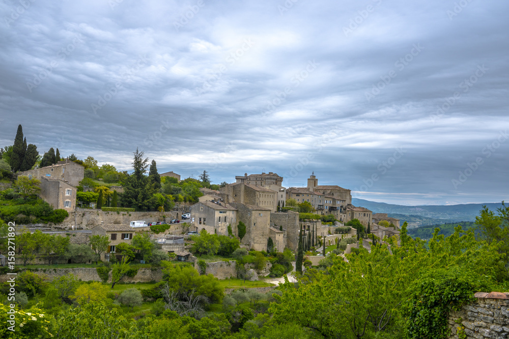 View on the beautiful medieval village of Gordes in the cloudy day. This village is included in list of 