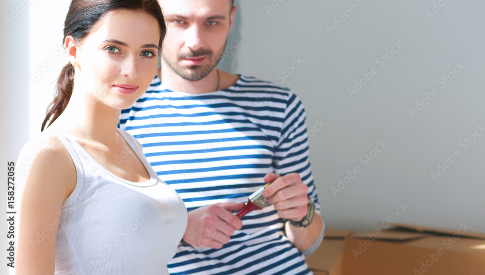 Fototapeta premium Happy young couple moving in new house