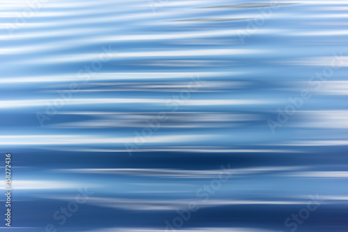 blue water background with ripples Sea low angle view, river, wave. Close up Nature background. Soft focus with selective focus