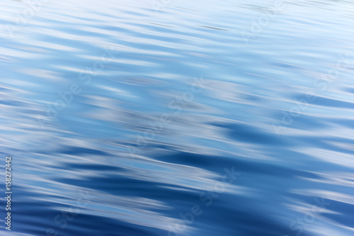 blue water background with ripples Sea low angle view  river  wave. Close up Nature background. Soft focus with selective focus