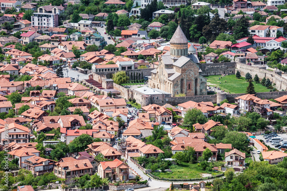 Svetitskhoveli Cathedral, center of Mtskheta, aerial view. A World Heritage site by UNESCO. Beautiful touristic town in Georgia. Famous tourist landmark.