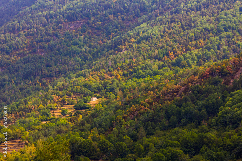 Solitary houses in the mountains of the natural park of ordesa huesca, spain