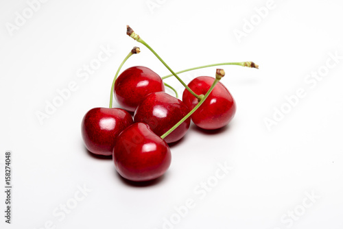 Five juicy red cherries