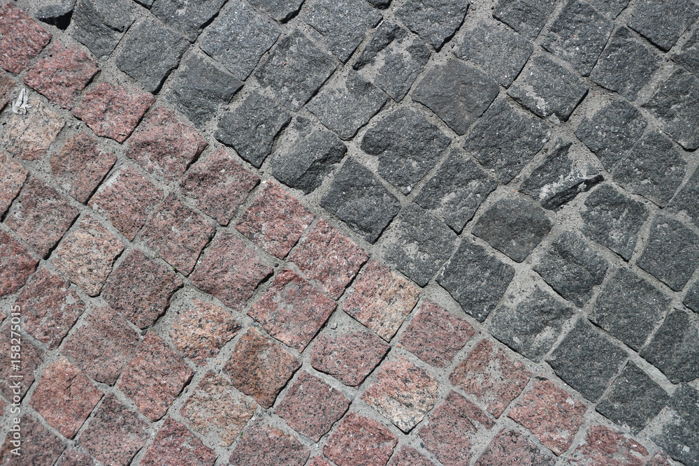 Rubble gray and brown square stones paved road Rubble gray and brown square stones paved road