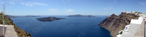 Cityscape of Fira, town at Santorini Isle (Greece) and Caldera of Volcano Nea Kameni.