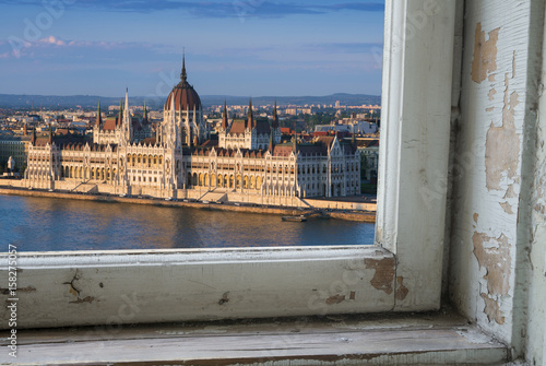 Canvas Print Looking through a castle window, the view of Buda in the foreground with the Hungarian Parliament building on the Pest side of Budapest in the background