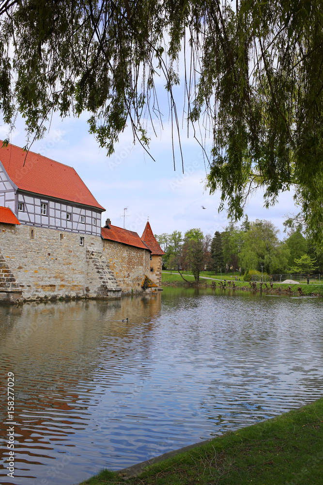 Weißenburg city. Bavaria. Germany. Part of the fortress wall and moat with water Weißenburg city. Bavaria. Germany. Part of the fortress wall and moat with water