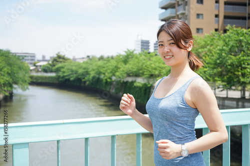 Young woman running in the city  © maroke