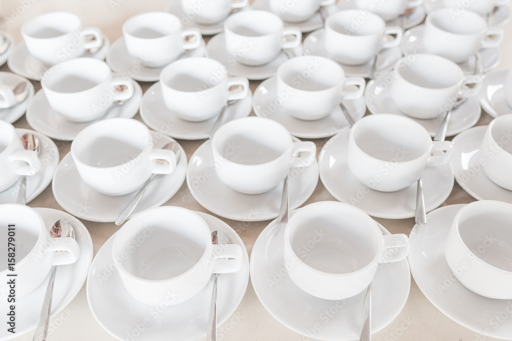 Group of empty coffee cups of white cup for service tea or coffee in breakfast or buffet and seminar event of catering and cocktail. Group of empty coffee cups of white cup for service tea or coffee in breakfast or buffet and seminar event of catering and cocktail.