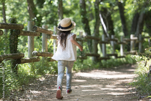Little girl walking on the mountain path © hakase420