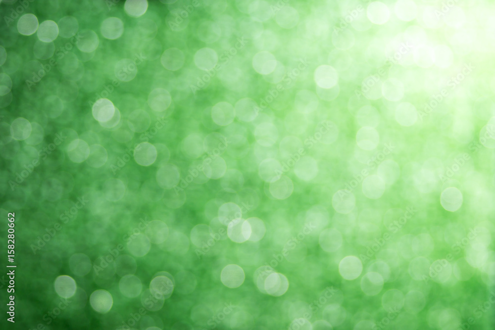 green background with blurred shiny bokeh