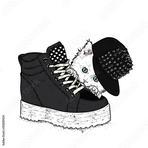 Lovely kitten in a stylish cap with spikes. A cat and a sneaker on a thick sole. Vector illustration for a postcard or a poster. Clothes and accessories. Fashion & Style.
