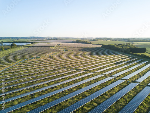An aerial view of a solar farm set in the english countryside