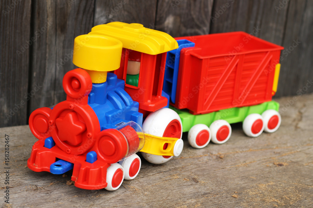 Obraz premium Multi-colored plastic locomotive in nature