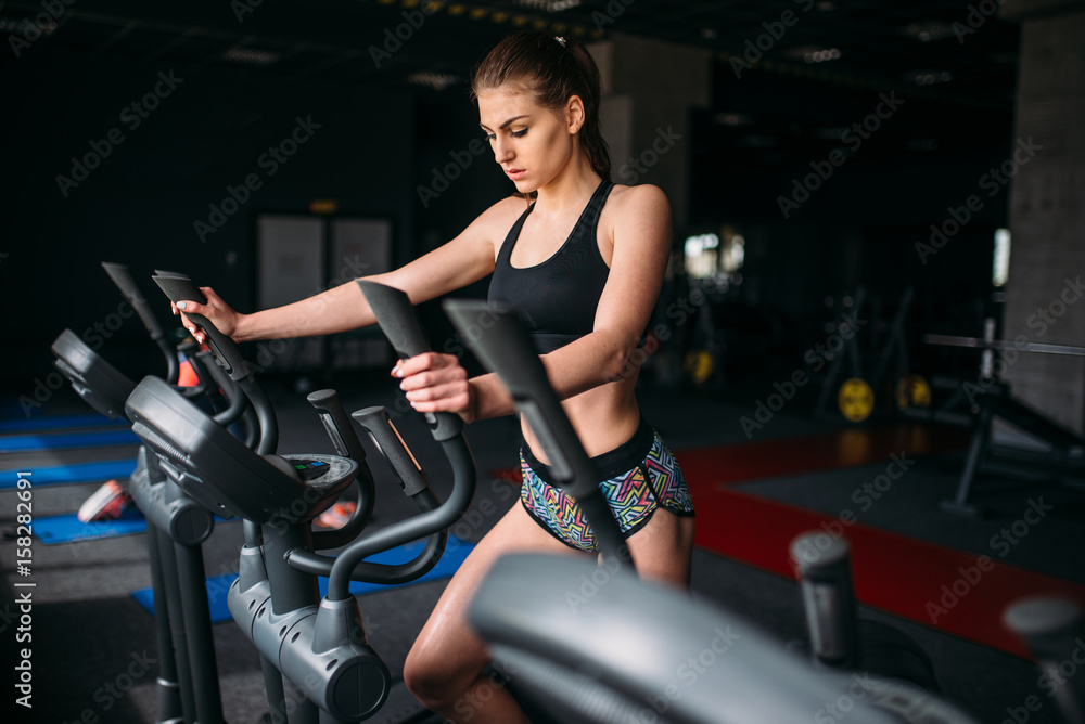 Female athlete exercise on treadmill in sport gym Female athlete exercise on treadmill in sport gym