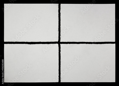 four pieces of torn paper on a black background