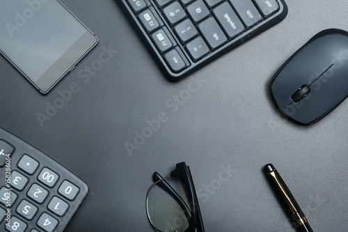 black office business equipment on black background