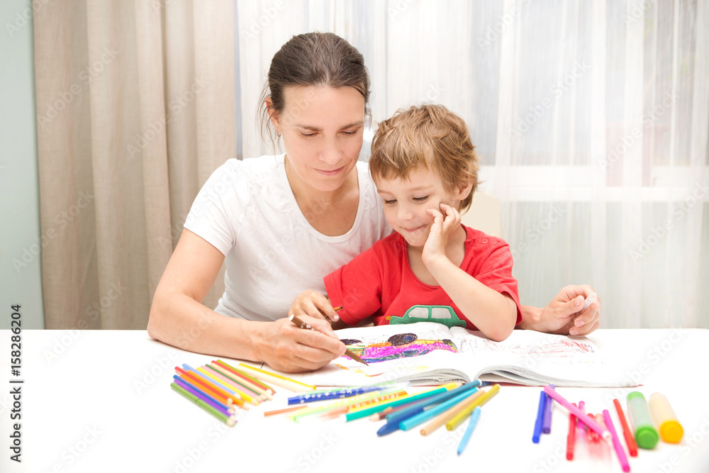 Happy family. Mother and little son together paint. Happy family. Mother and little son together paint.