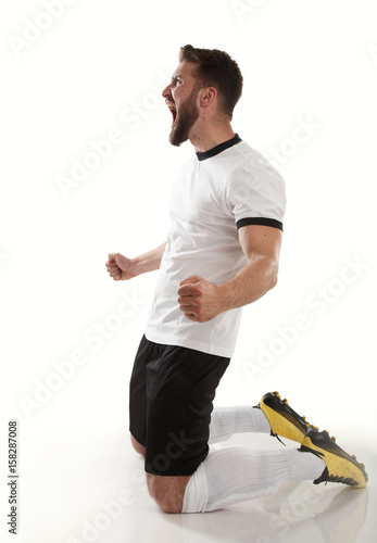 Wütender Sportler  im Fußballtrikot  photo