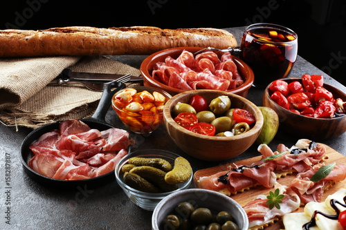 spanish tapas and sangria on wooden table - mediterran antipasti