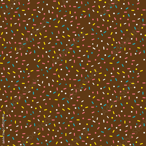 Seamless pattern with sweets on the chocolate background.