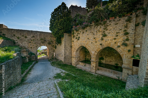 VOLTERRA, TUSCANY - MAY 21, 2017 - The door and the source of San Felice photo