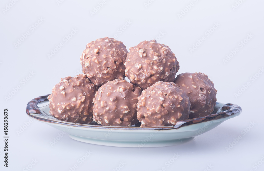 chocolate ball or chocolate bonbon on a background. chocolate ball or chocolate bonbon on a background.