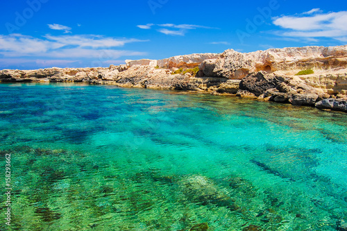 Rock cliffs and sea bay with azure water near Protaras, Cyprus island