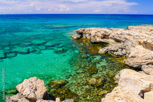 Rock cliffs and sea bay with azure water near Protaras, Cyprus island