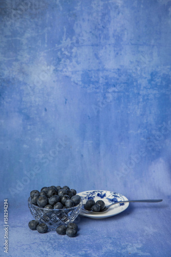 Bowl Of Blueberries With Saucer And Spoon