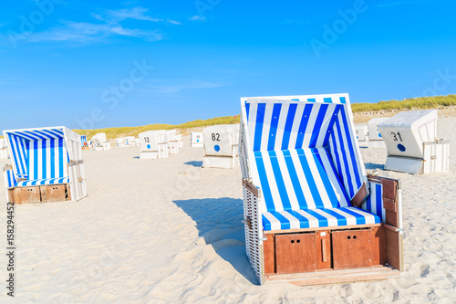 Wicker chairs on white sand Kampen beach  Sylt island  North Sea  Germany