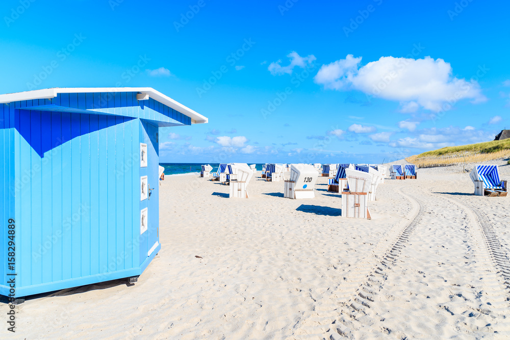 Wicker chairs on sandy beach in Kampen village on Sylt island, North Sea, Germany Wicker chairs on sandy beach in Kampen village on Sylt island, North Sea, Germany